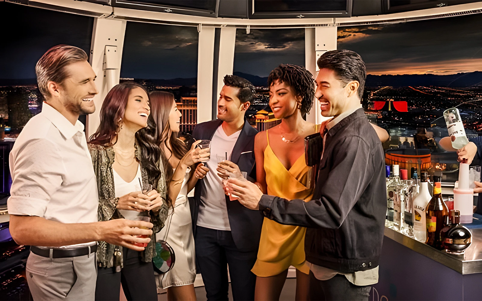 Guests enjoying a party inside High Roller Observation Wheel in Las Vegas at night.