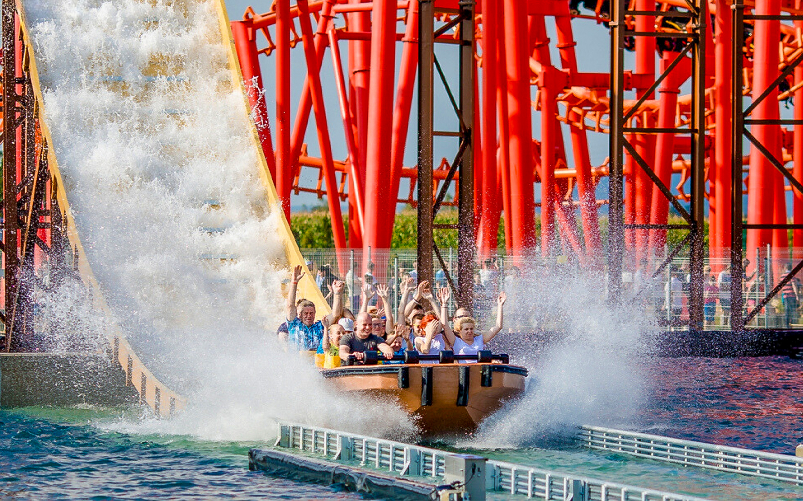 Roller coaster Anaconda at Energylandia theme park, Poland, with vibrant loops and twists.