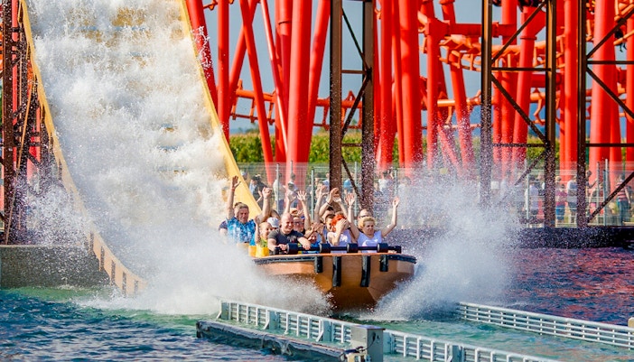 Roller coaster Anaconda at Energylandia theme park, Poland, with vibrant loops and twists.