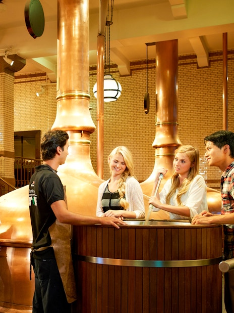 Visitors enjoying a tour inside the Heineken brewery, Amsterdam.