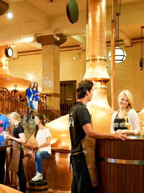 Visitors enjoying a tour inside the Heineken brewery, Amsterdam.