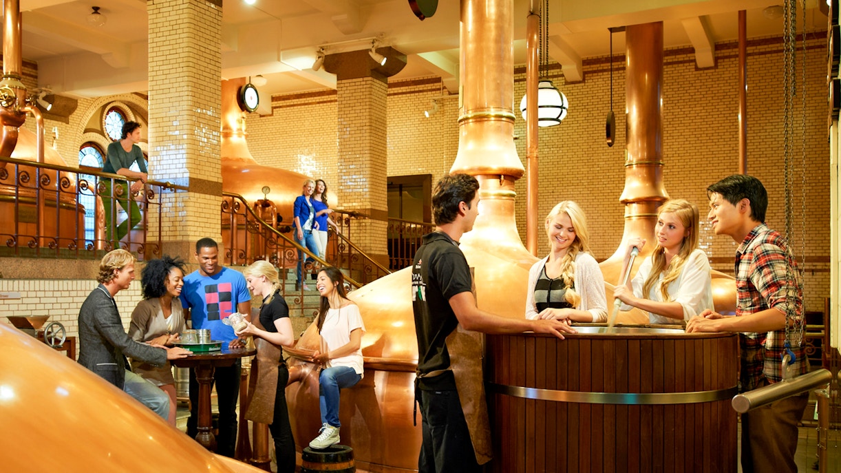 Visitors enjoying a tour inside the Heineken brewery, Amsterdam.