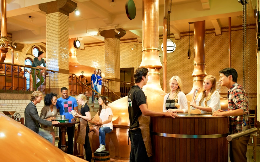 Visitors enjoying a tour inside the Heineken brewery, Amsterdam.