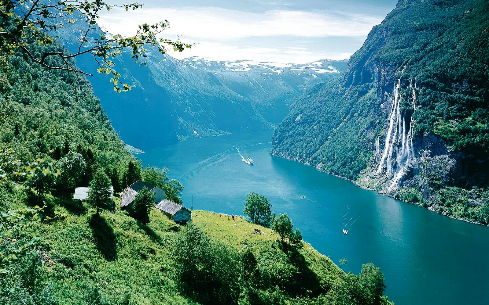 Geiranger Fjord with boat and waterfall, Norway.