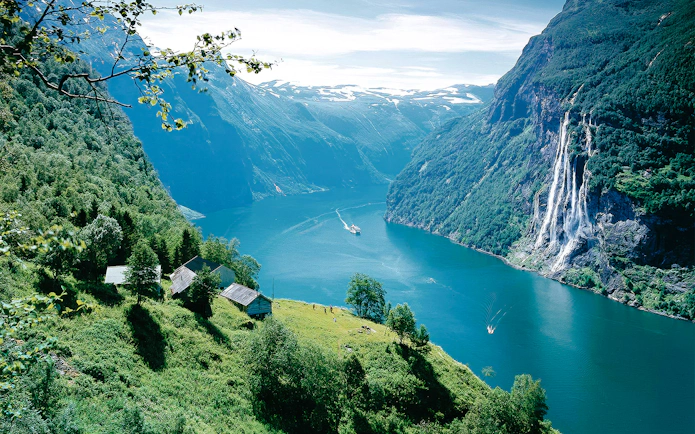 Geiranger Fjord with boat and waterfall, Norway.