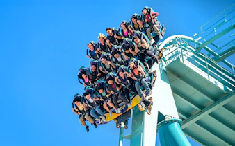 Visitors on a roller coaster at SeaWorld San Diego.