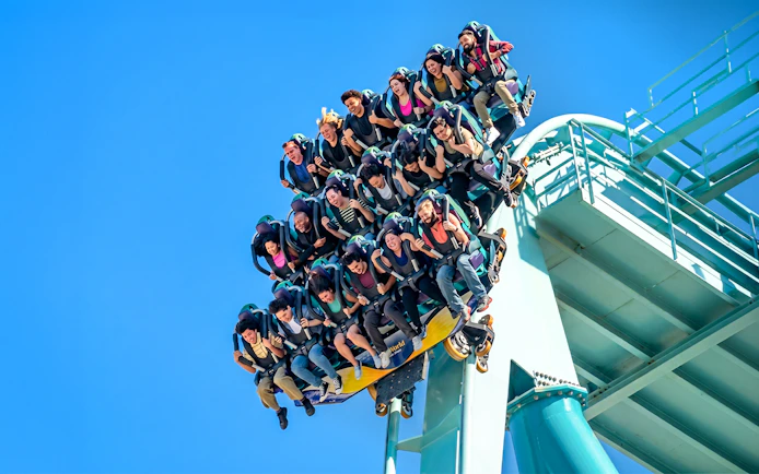 Visitors on a roller coaster at SeaWorld San Diego.