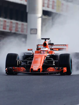 Formula 1 car racing on track at Barcelona Grand Prix.