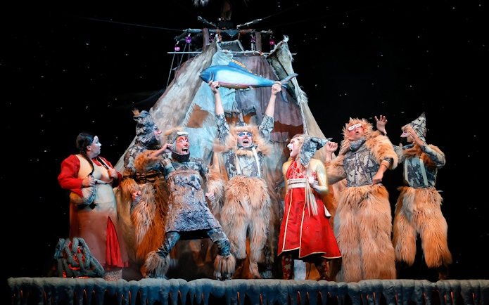 Performers in elaborate costumes on stage during Cirque du Soleil KÀ show.