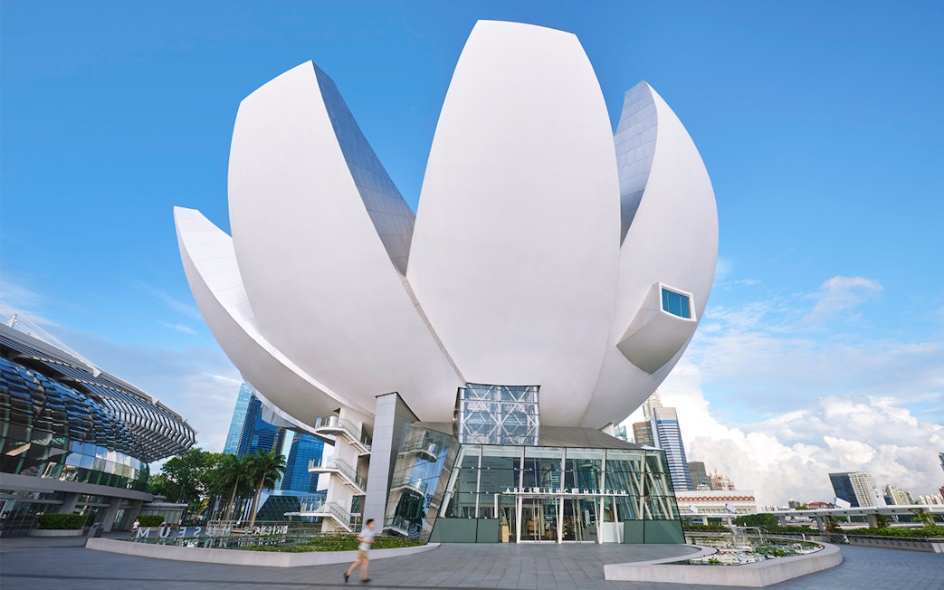 ArtScience Museum lotus-shaped building in Singapore against blue sky.