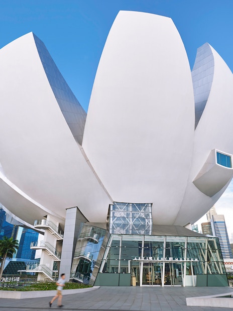 ArtScience Museum lotus-shaped building in Singapore against blue sky.