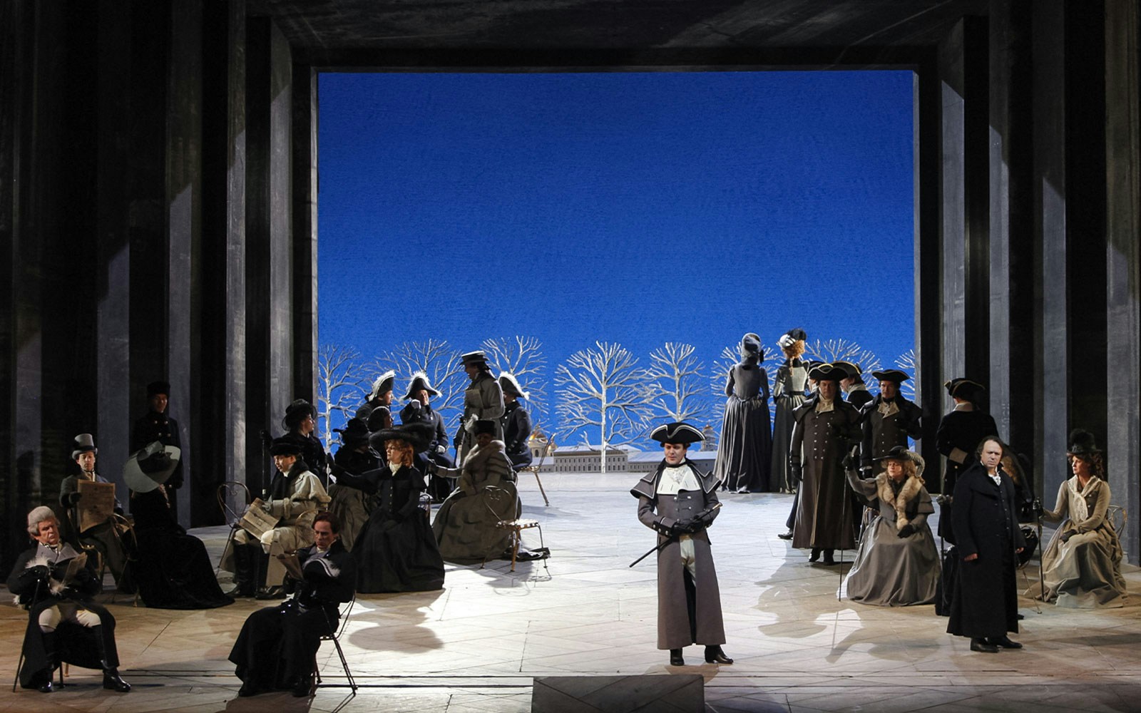 Opera performance of "The Queen of Spades" with actors in period costumes on stage.