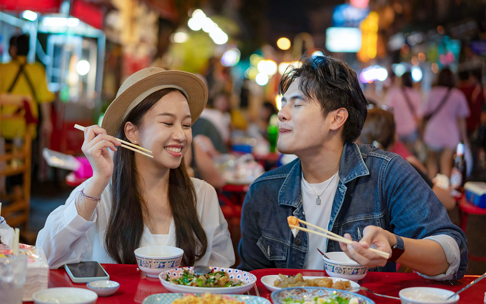 A couple eating food.