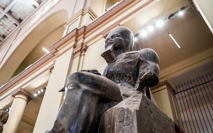 Statue of a Pharaoh in the Grand Egyptian Museum, Cairo, Egypt.