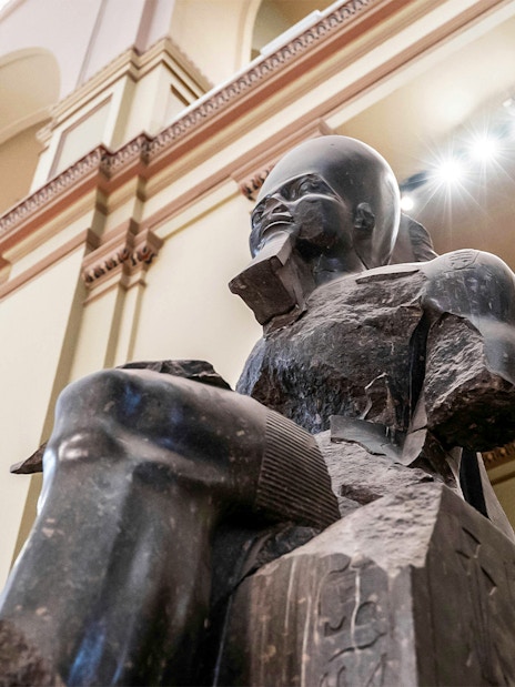 Statue of a Pharaoh in the Grand Egyptian Museum, Cairo, Egypt.