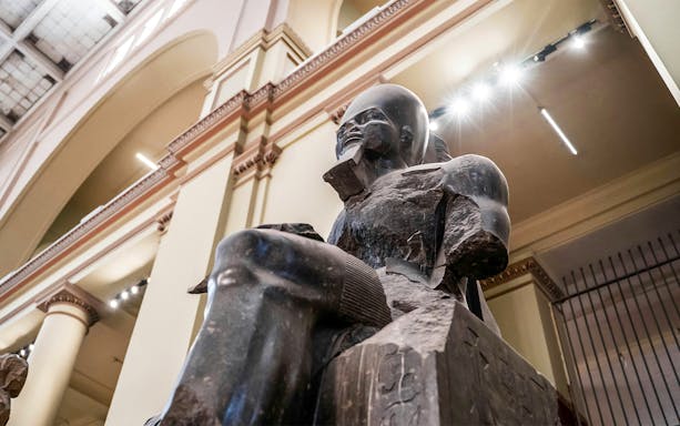 Statue of a Pharaoh in the Grand Egyptian Museum, Cairo, Egypt.