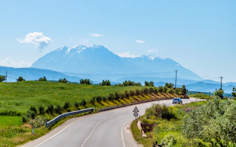 Winding road with mountain views on Berat City & Belshi Lake Day Trip from Durres.