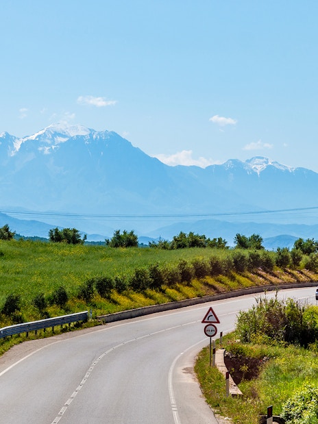 Winding road with mountain views on Berat City & Belshi Lake Day Trip from Durres.