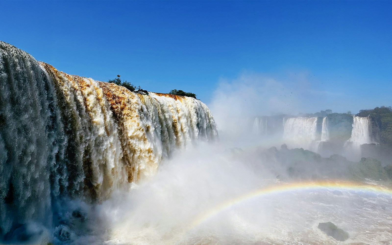 Rainbow emerging at Iguazu Falls