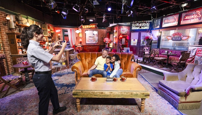Family posing on Central Perk set at Warner Bros Studio, Los Angeles.