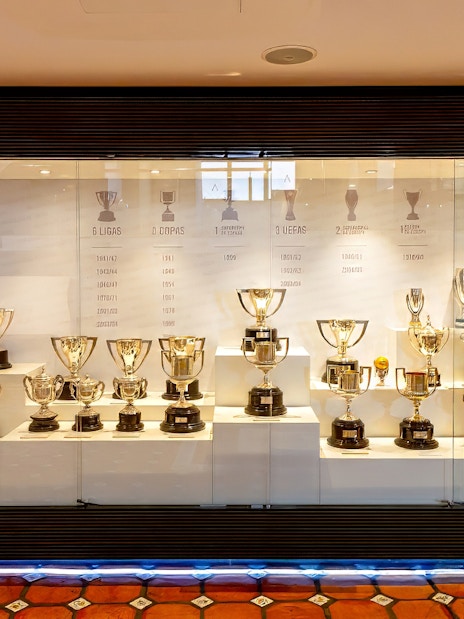 Valencia CF trophy display at Mestalla Forevertour in Valencia, showcasing various football cups and awards.