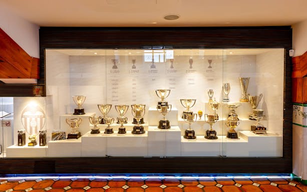 Valencia CF trophy display at Mestalla Forevertour in Valencia, showcasing various football cups and awards.