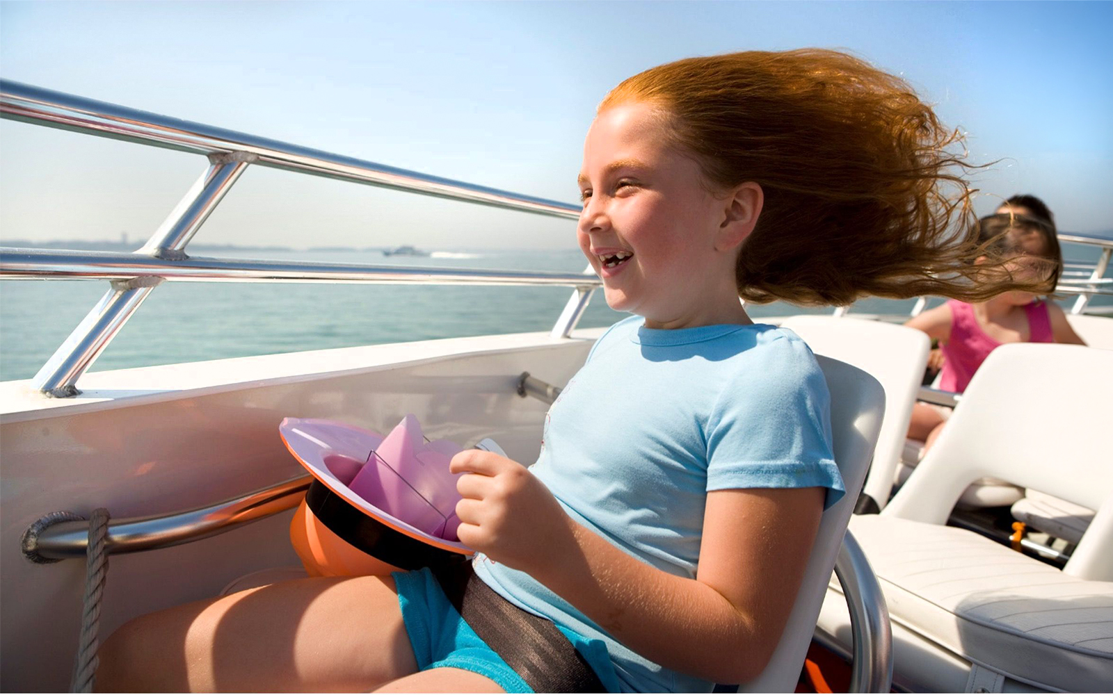 Child enjoying the CODZILLA thrill-boat ride in Boston.