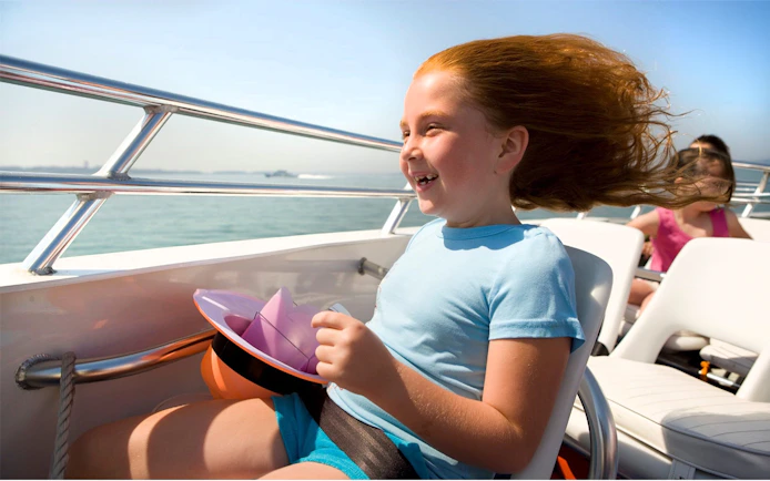 Child enjoying the CODZILLA thrill-boat ride in Boston.