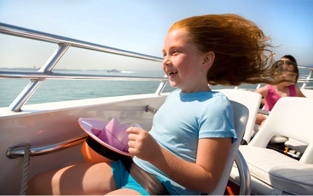 Child enjoying the CODZILLA thrill-boat ride in Boston.