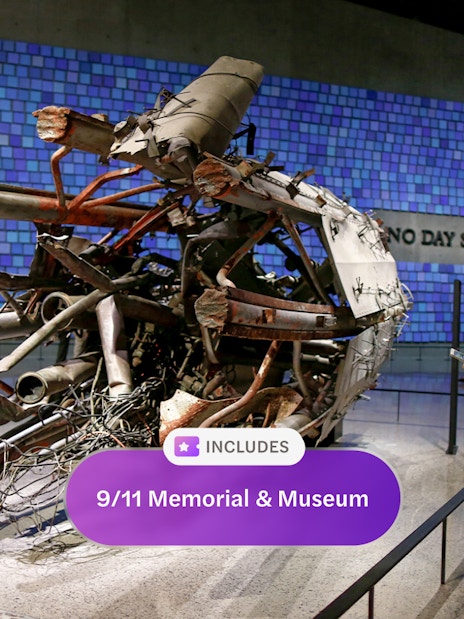 Wreckage display at 9/11 Memorial and Museum with visitors observing.