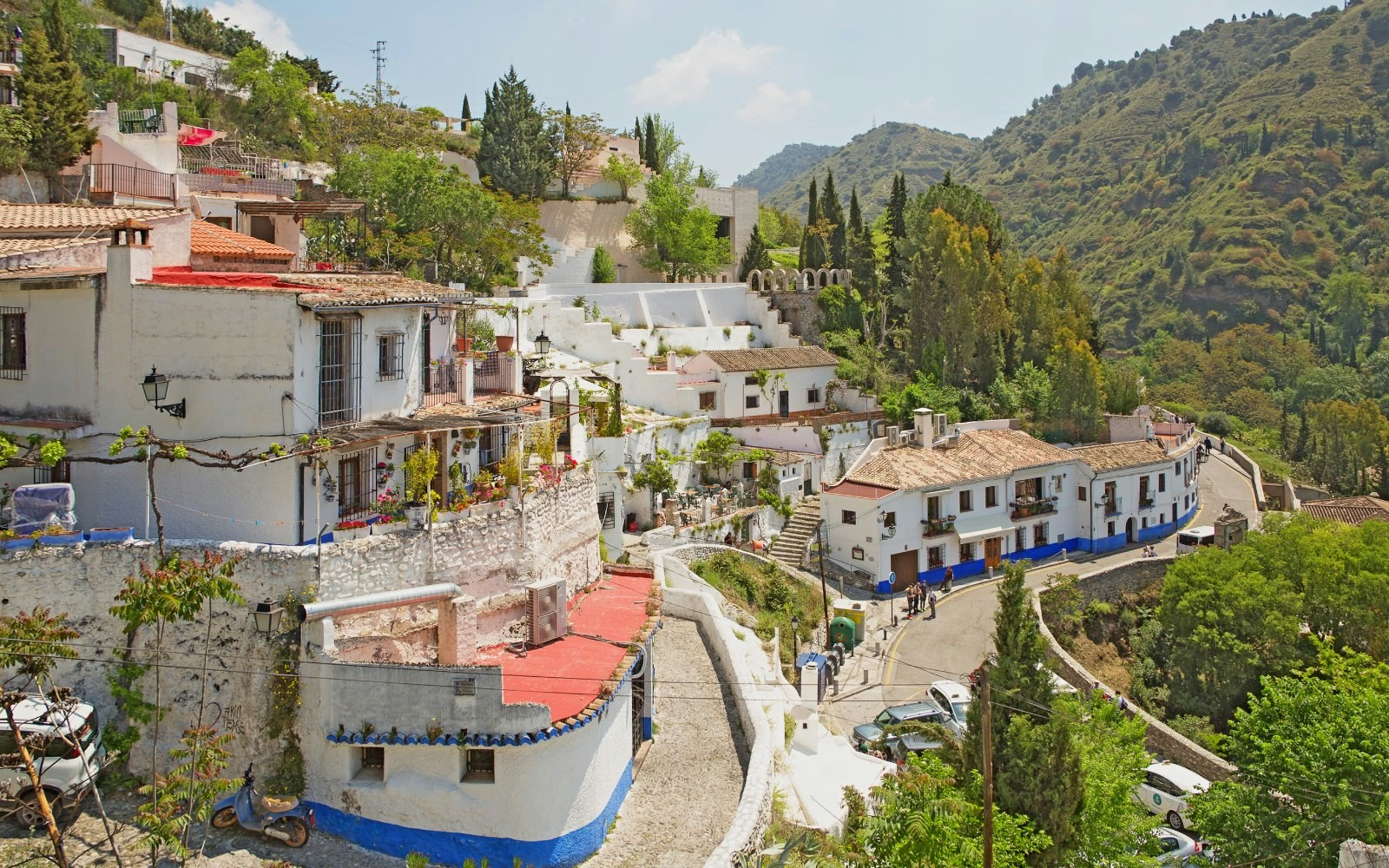 Sacromonte village cave houses on hill slopes, Granada, Spain.