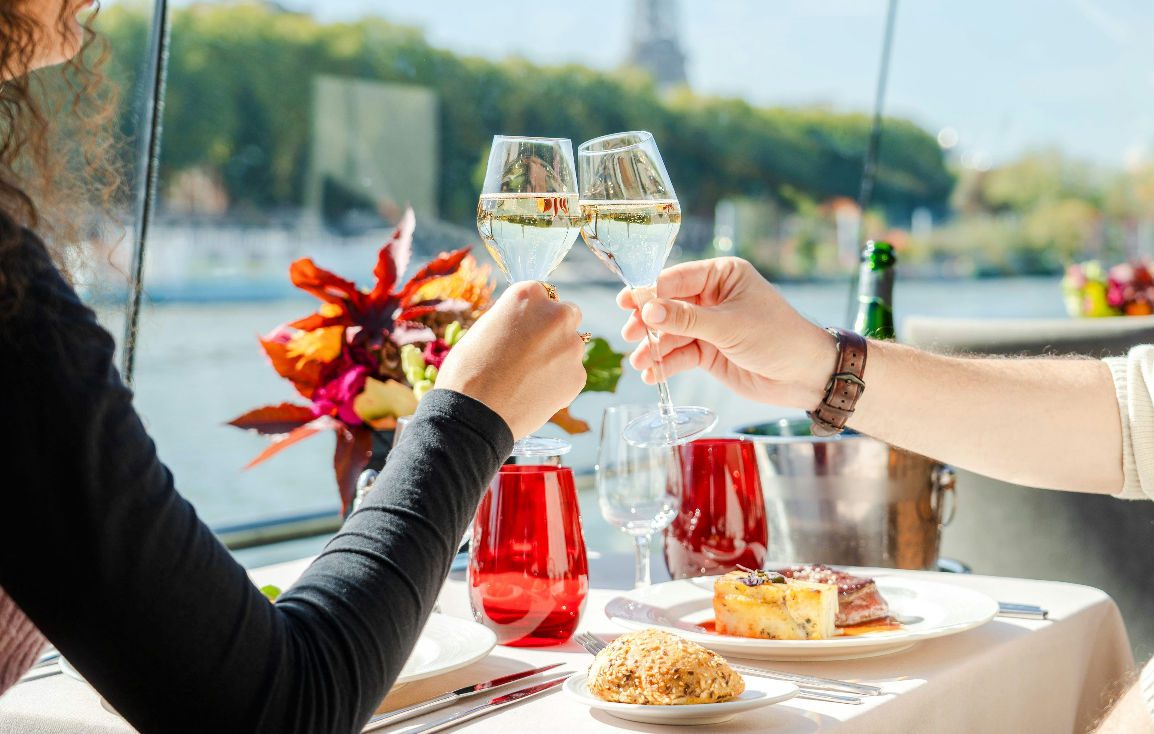 Toasting with champagne on a Bateaux Mouches Seine River cruise in Paris.