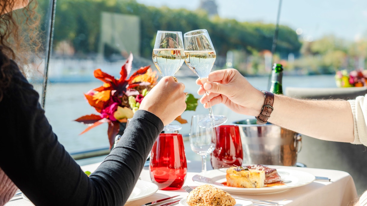 Toasting with champagne on a Bateaux Mouches Seine River cruise in Paris.