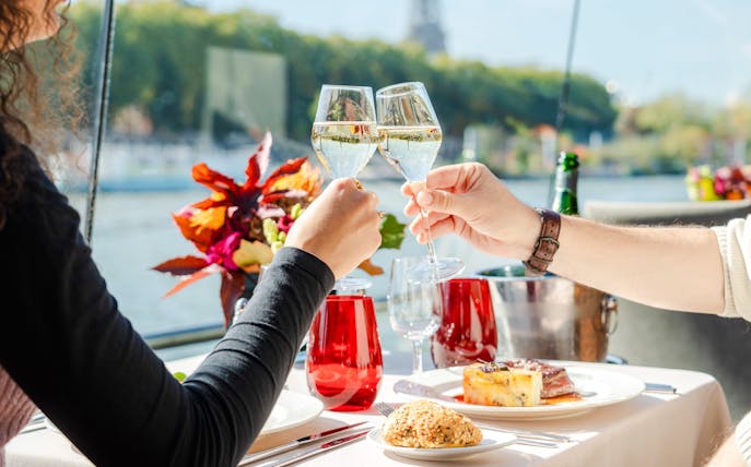 Toasting with champagne on a Bateaux Mouches Seine River cruise in Paris.