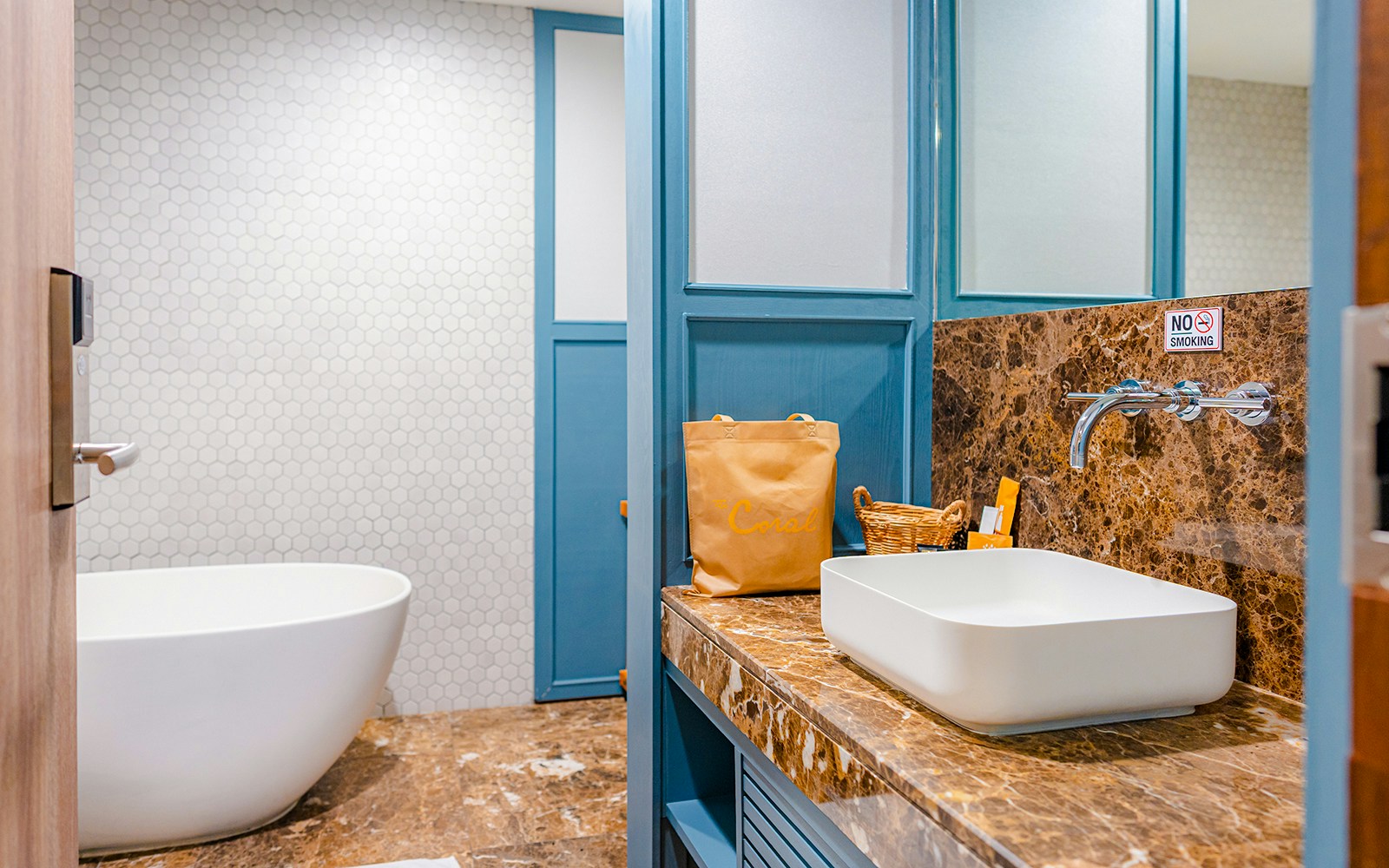 Luxurious bathroom in Coral Finest Business Class Lounge, Bangkok airport, featuring a modern sink and bathtub.