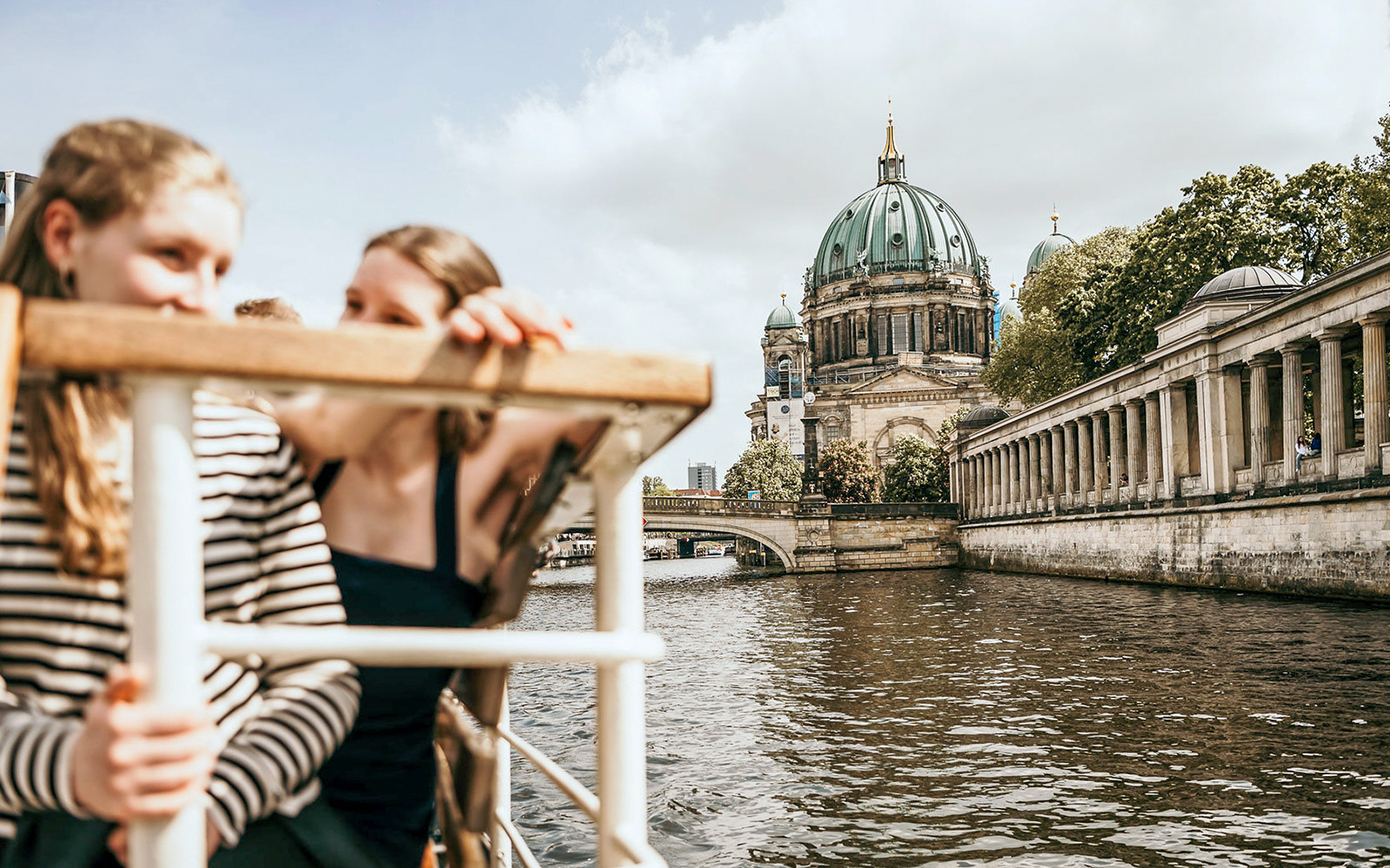 Berlin Cathedral viewed from a boat on the Spree River during a city cruise.