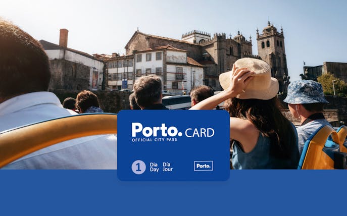 Tourists on a bus in Porto with view of historic buildings, promoting Porto.CARD benefits.