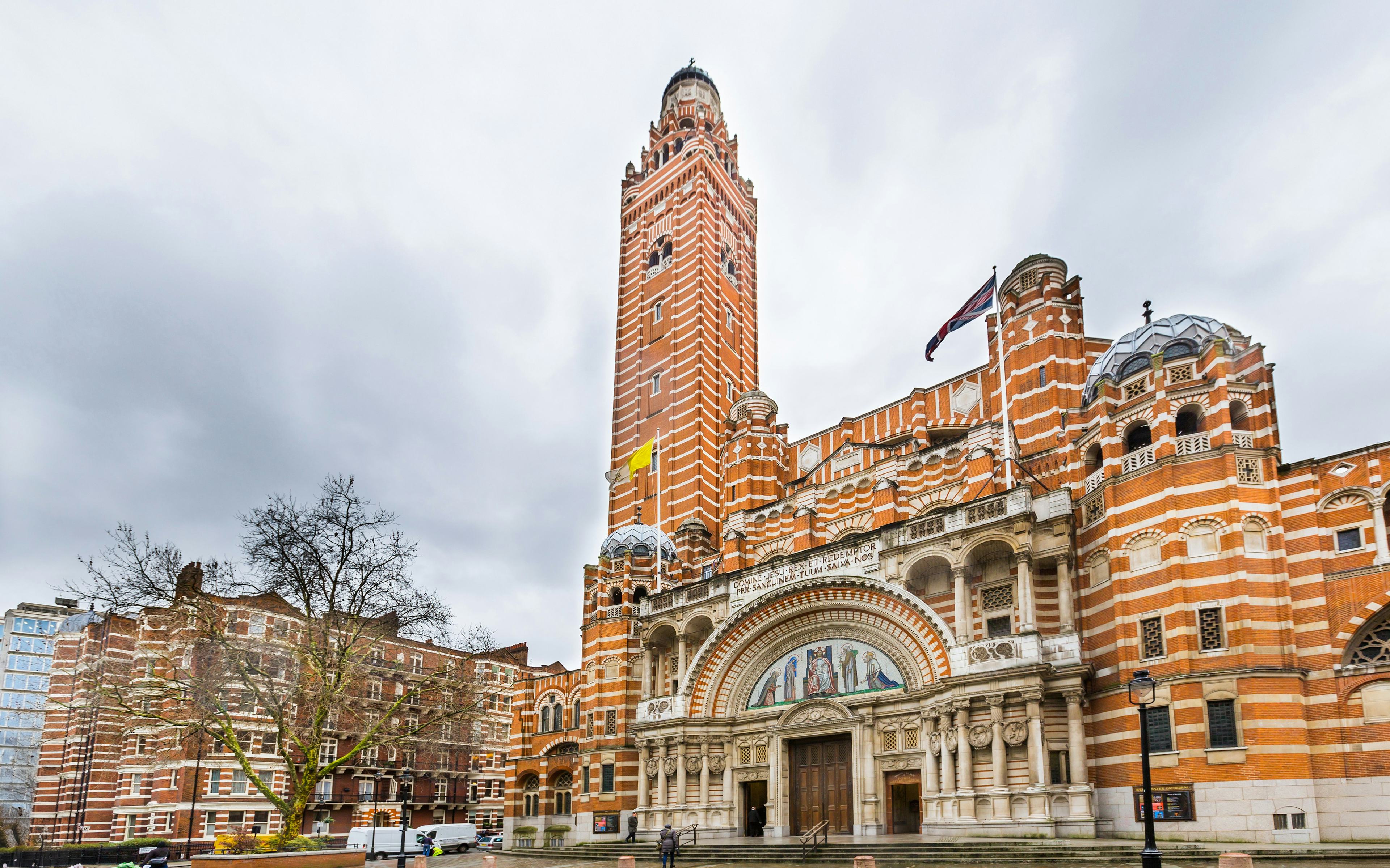 Westminster Cathedral's facade with its distinctive red brick and bell tower in London.