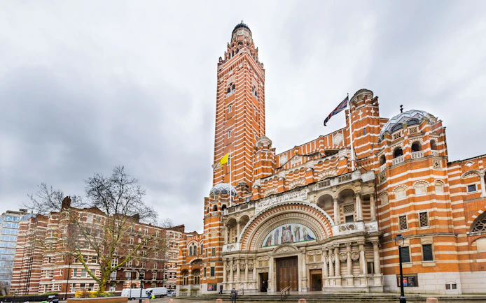 Westminster Cathedral's facade with its distinctive red brick and bell tower in London.