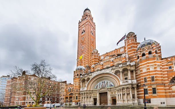 Westminster Cathedral's facade with its distinctive red brick and bell tower in London.