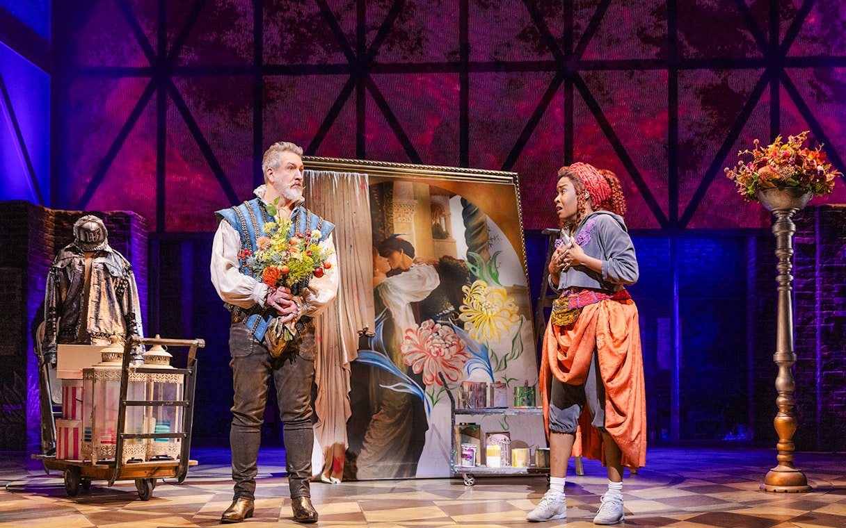 Actors in period costumes on stage during a scene from "& Juliet" musical.