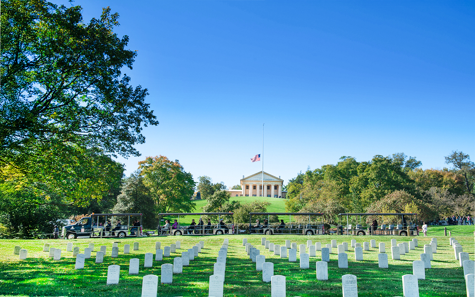 Tram tour at Arlington National Cemetery with Memorial in background, Washington, D.C.