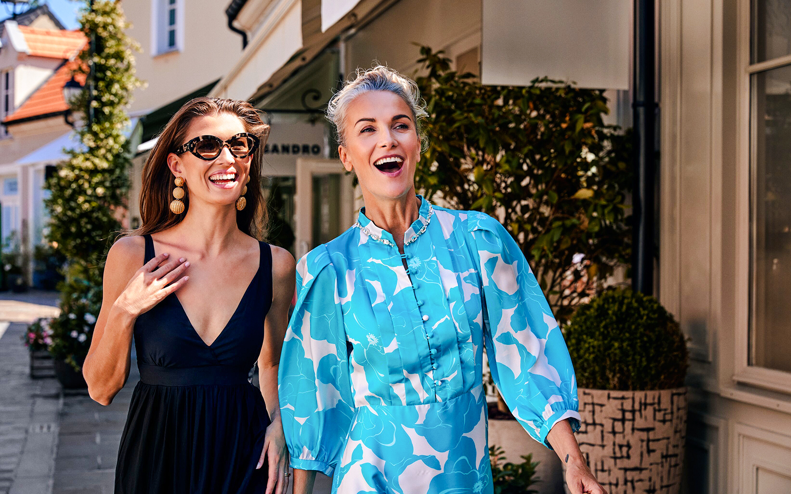 People enjoying a walk in La Vallée Village, Paris, France.