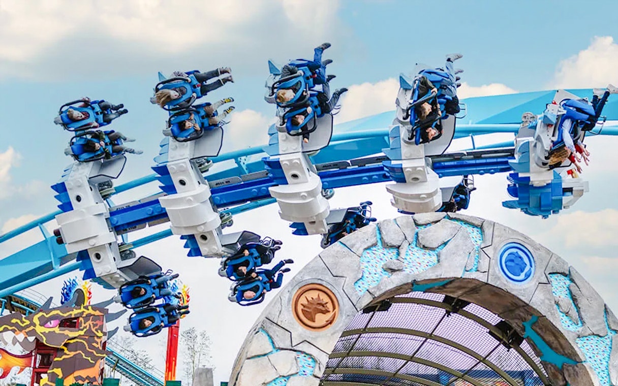 Guests on a roller coaster at LEGOLAND Deutschland.