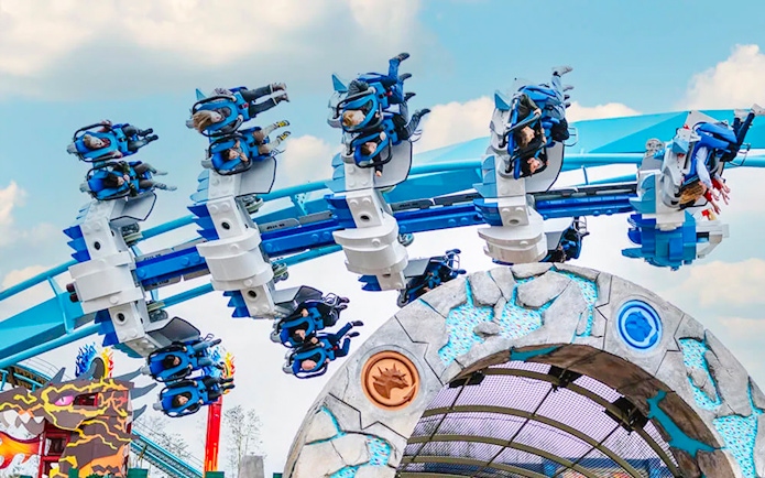 Guests on a roller coaster at LEGOLAND Deutschland.