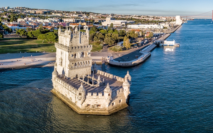 Belem Tower in Lisbon, Portugal, surrounded by the Tagus River, viewed from above.