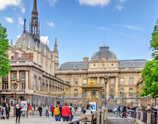 Sainte Chapelle Paris exterior with intricate Gothic architecture and stained glass windows.