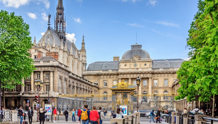 Sainte Chapelle Paris exterior with intricate Gothic architecture and stained glass windows.