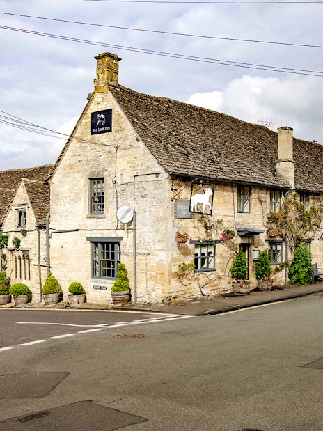 Historic stone pub in Cotswolds village, part of Oxford tour with country lunch.
