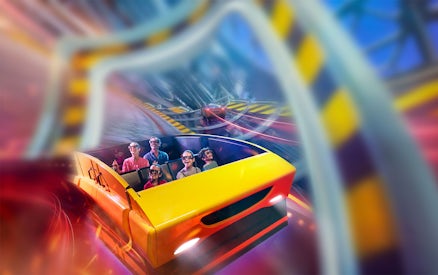 Visitors enjoying a roller coaster ride at Ferrari World Abu Dhabi.